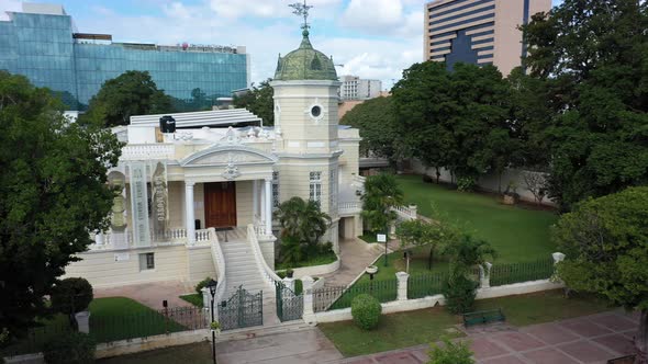 Slow aerial orbit showing the Casa Museo Quinta Montes Molina on the Paseo Montejo in Merida, Yucata