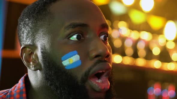 Black Football Fan With Argentinian Flag Cheering for Favorite Team Victory