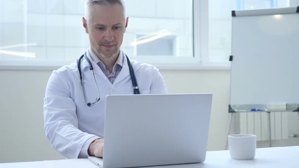 Smiling Positive Doctor At Work Looking at Camera