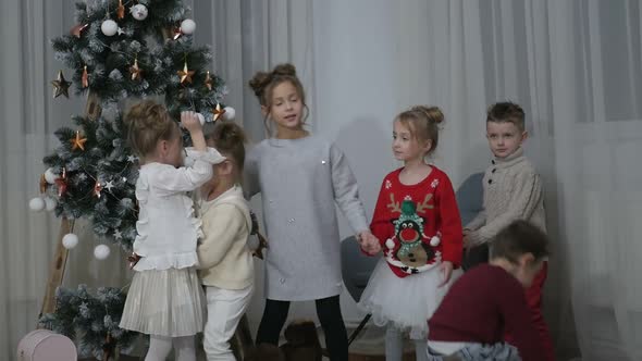 A group of children with New Year's gifts, happy friends for Christmas