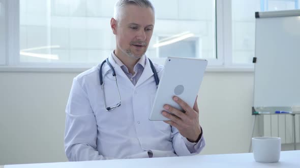 Online Video Chat on Tablet By Doctor