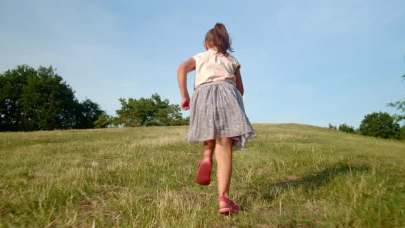 Little Girl Runs Up the Hill