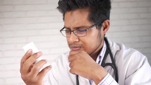 Doctor Hand Holding Pill Container with Copy Space