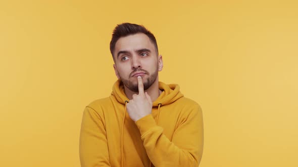 Expressive young man screaming and shouting over vibrant background.