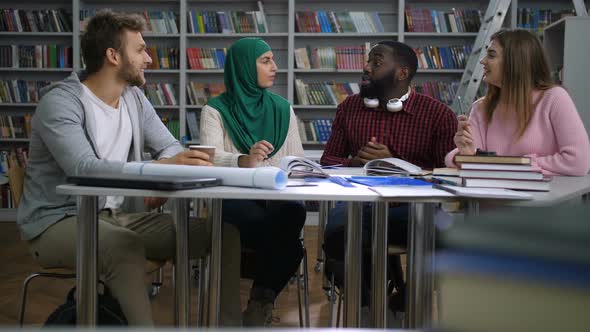 Multiracial Friends Working on University Project