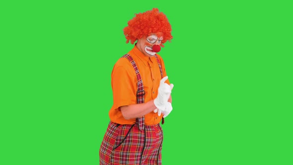 Clown Using Imaginary Digital or Virtual Screen on a Green Screen Chroma Key