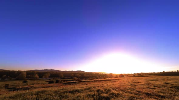  UHD Mountain Meadow Timelapse at the Summer. Clouds, Trees, Green Grass and Sun Rays Movement