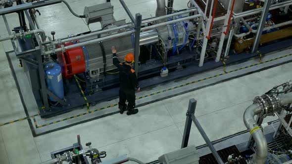 A Service Engineer Inspects Equipment at Work