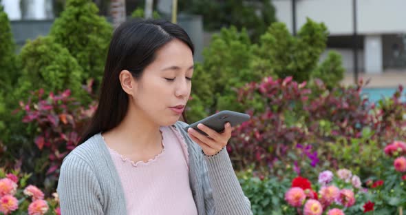 Woman use of smart phone in city