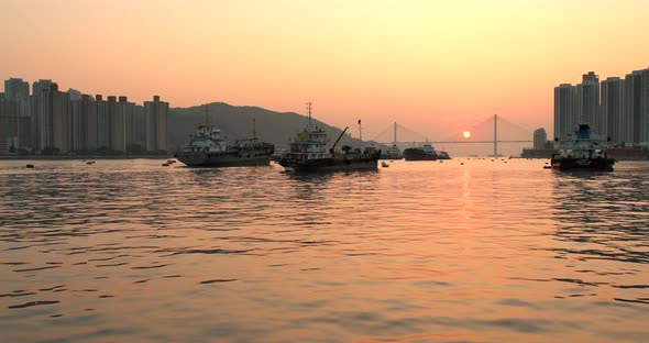 Hong Kong seascape and fish boat under sunset