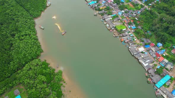 Aerial Shot of Local Fisherman Village Beside the sea.