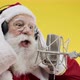 Santa Claus singing or speaking in a studio microphone. Merry Christmas - VideoHive Item for Sale