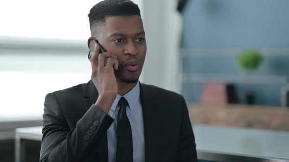 Portrait of African Businessman Talking on Smartphone