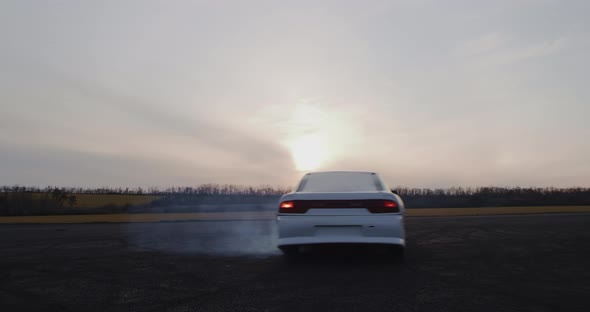 Car Drifting at Twilight in Countryside