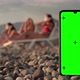 A Phone with a Green Screen and Tracking Points on the Beach Three Multiracial Girls in Swimsuits - VideoHive Item for Sale