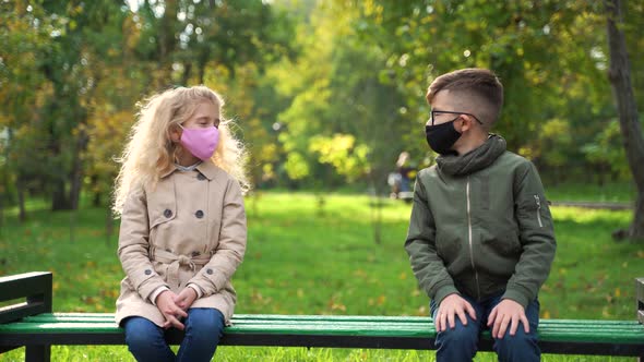 Children Wearing Face Mask Outside in the Coronavirus COVID19 Pandemic