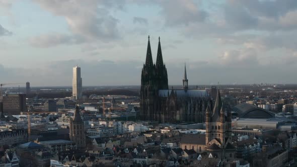 AERIAL: Wide Shot of Cologne Germany From the Air with Majestic Cathedral on Sunny Day 