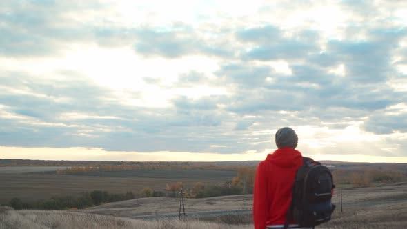 Man with a Backpack on a Hike