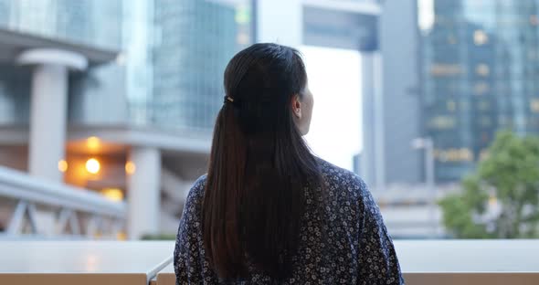 Woman look around in city, business corporate tower background