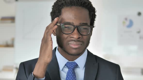 Headache Stressed African Businessman with Head Pain