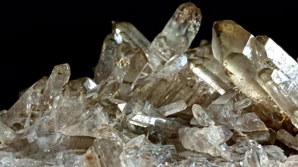 Mountain Quartz Crystal . Rotates on a Black Background. Macro