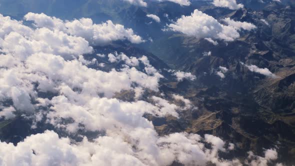 Flying Above the Clouds and the Mountains