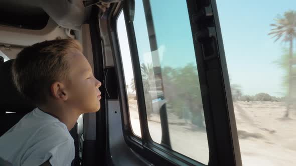 Wind Blowing To Child Face During Car Journey