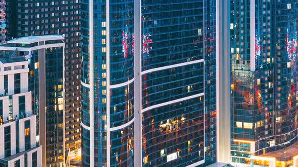 Street Night Yellow Illumination Reflected in Skyscrapers Windows