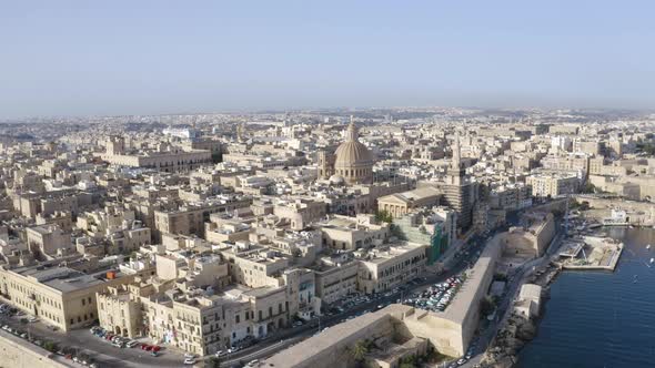 Historical city of Valletta,Malta,with stone harbor,sunny day,aerial.