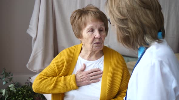 Female Senior Patient Tells Doctor About Her Health Complaints. Doctor Visits