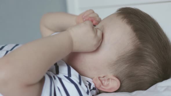 Portrait Caucasian Child Boy Kid Lying Bed Not Sleeping Touching Eyes Closing