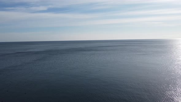 Aerial View From Above on Azure Sea and Pink Pebbles Beach