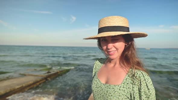 Portrait of a Young Caucasian Beauty Woman with the Ocean in the Background