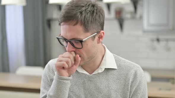 Portrait of Sick Young Man Coughing