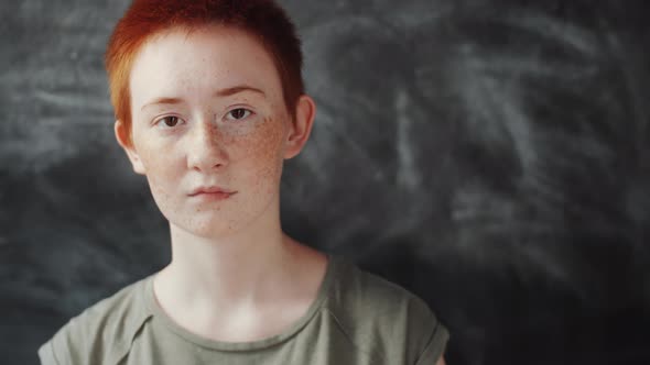 Young Redhead Woman with Short Haircut Posing for Camera