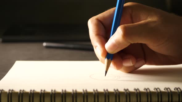 Hand drawing a flat line with a black pencil