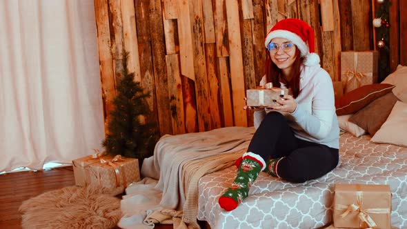 Smiling Woman with Christmas Gift