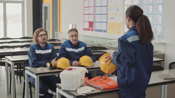 Workers Discussing Safety Rules At Manufacturing Workplace