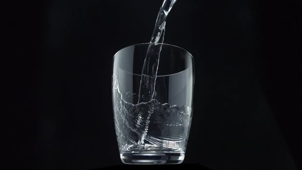 Pouring water into glass, Slow Motion