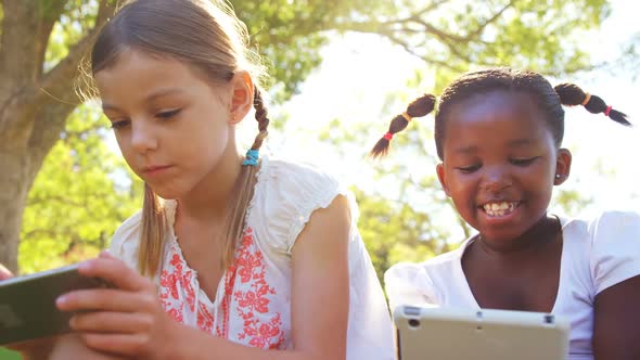 Kids using mobile phone and digital tablet