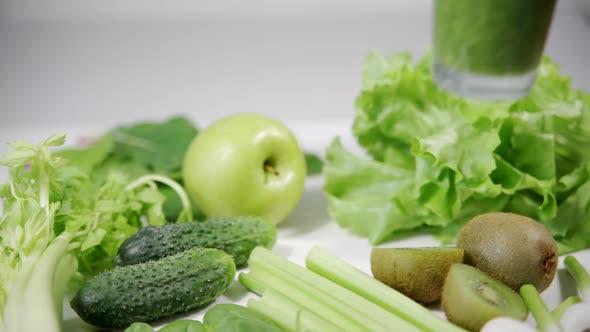 A Woman's Hand Takes a Glass with a Tasty and Healthy Smoothie Drinks the Liquid and Puts It Back