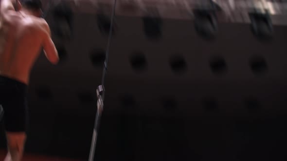 Acrobatic Man Flying on Rotating Performance at the Circus Arena