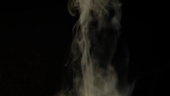 White smoke, fog, mist, vapor on a black background.