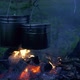 Cooking Dinner in Hanging Cauldrons on the Campfire in the Night Foggy Forest in Hike. - VideoHive Item for Sale