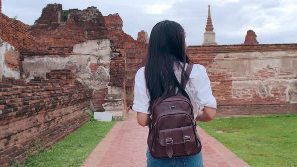 Japanese backpacker female enjoy her journey at amazing landmark in traditional city.