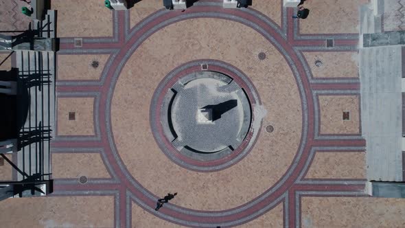 Top down view from drone as it descends over obelisk, landmark, Muizenberg, South Africa