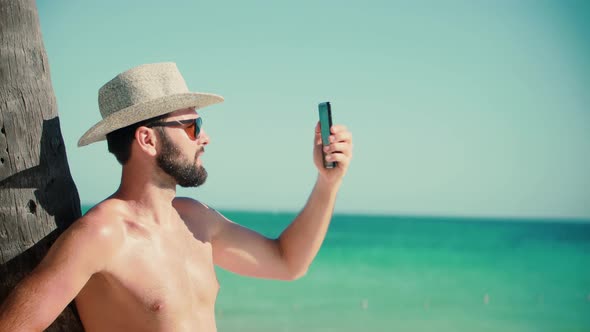 Selfie On Smartphone In Beautiful Place. Man Using Mobile Phone For Selfie Photo. Guy Taking Picture