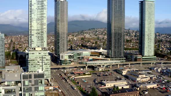 Brentwood Town Centre Station With Four High-rise Architectures With Traffic In The Road In Burnaby,