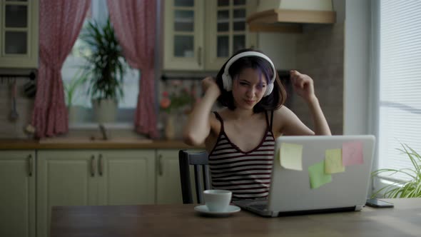 Young Beautiful Brunette Woman Listening To Music