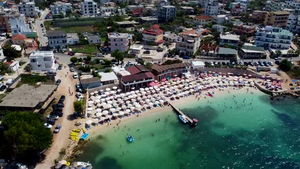 Albania view from the drone shooting on the beach beach with umbrellas